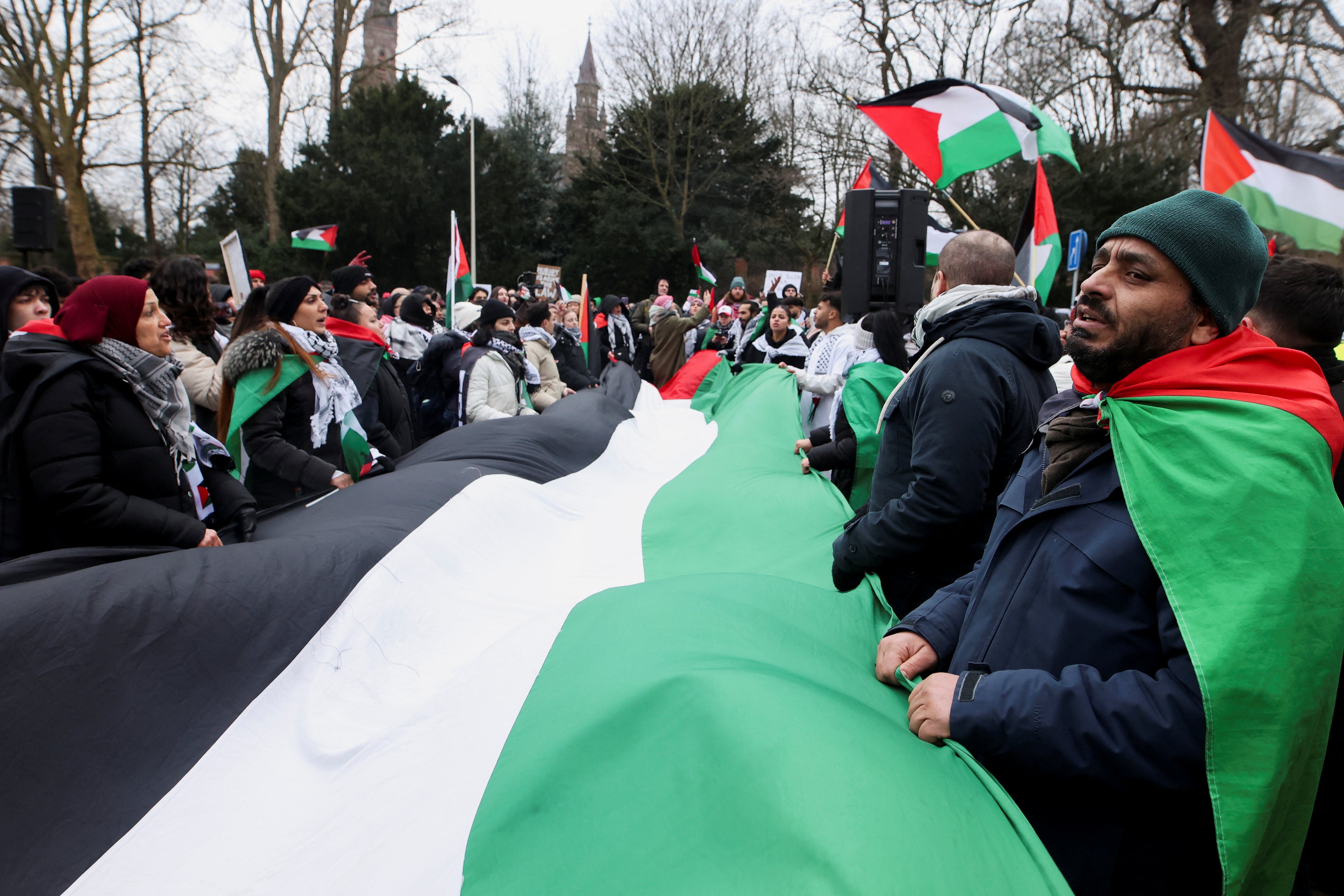 Pro-Palestinian demonstrators protest outside the International Court of Justice