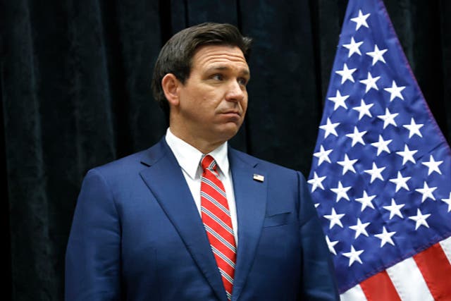 <p>Republican presidential candidate Florida Governor Ron DeSantis listens as Rep. Chip Roy (R-TX) speaks with reporters at a media center in a Sheraton Hotel on January 09, 2024 in Des Moines, Iowa. </p>