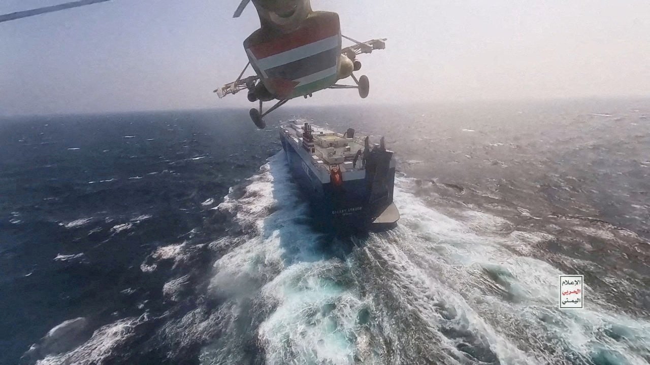 <p>Houthi military helicopter over the Galaxy Leader cargo ship in the Red Sea during an incident in November </p>