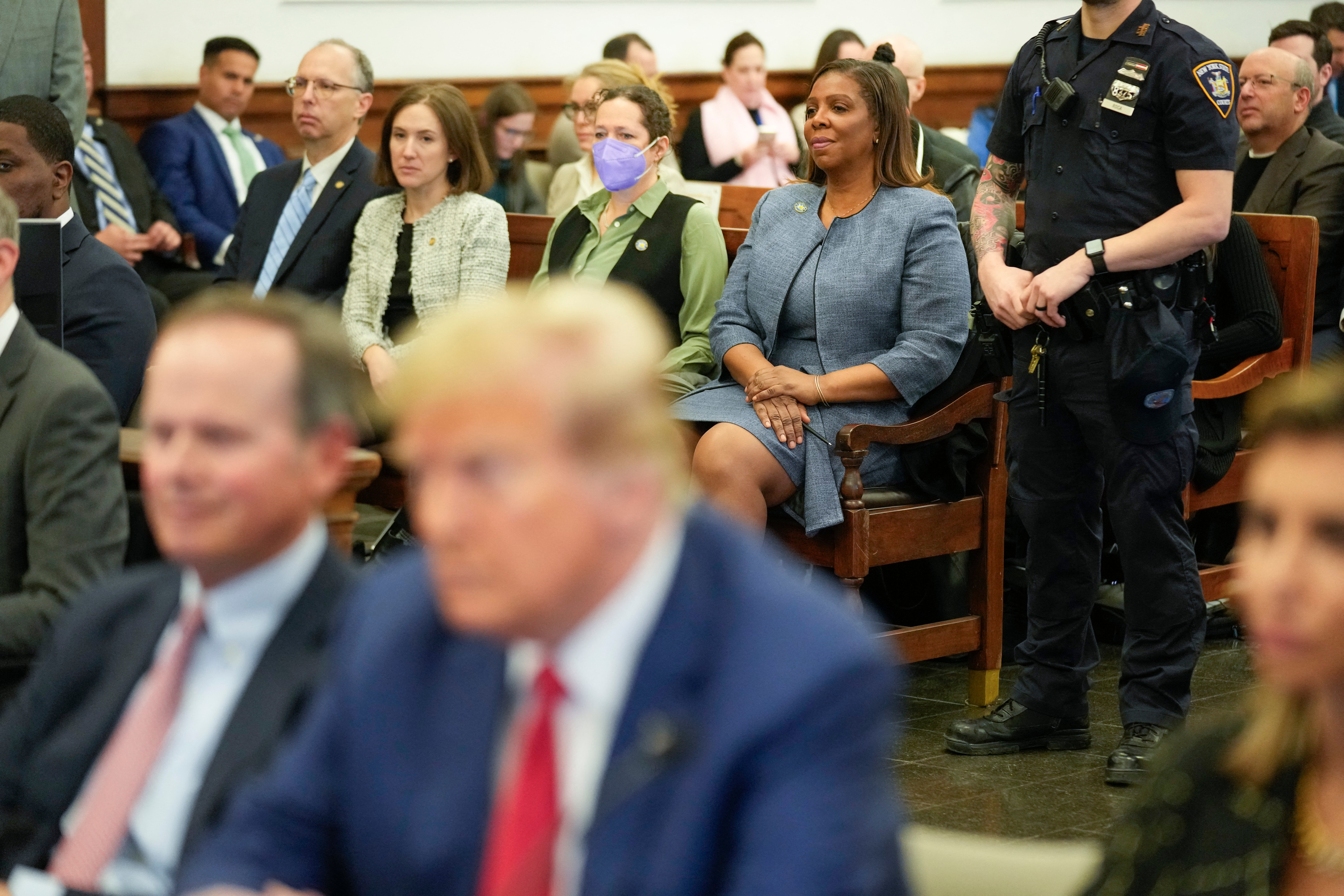 New York Attorney General Letitia James (C, top) sits in New York State Supreme Court during the civil fraud trial against the Trump Organization