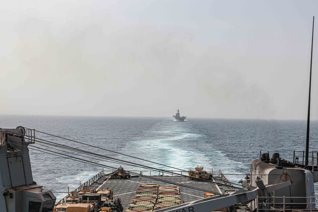 <p>In this image provided by the U.S. Navy, the amphibious dock landing ship USS Carter Hall and amphibious assault ship USS Bataan transit the Bab al-Mandeb strait in August 2023 </p>