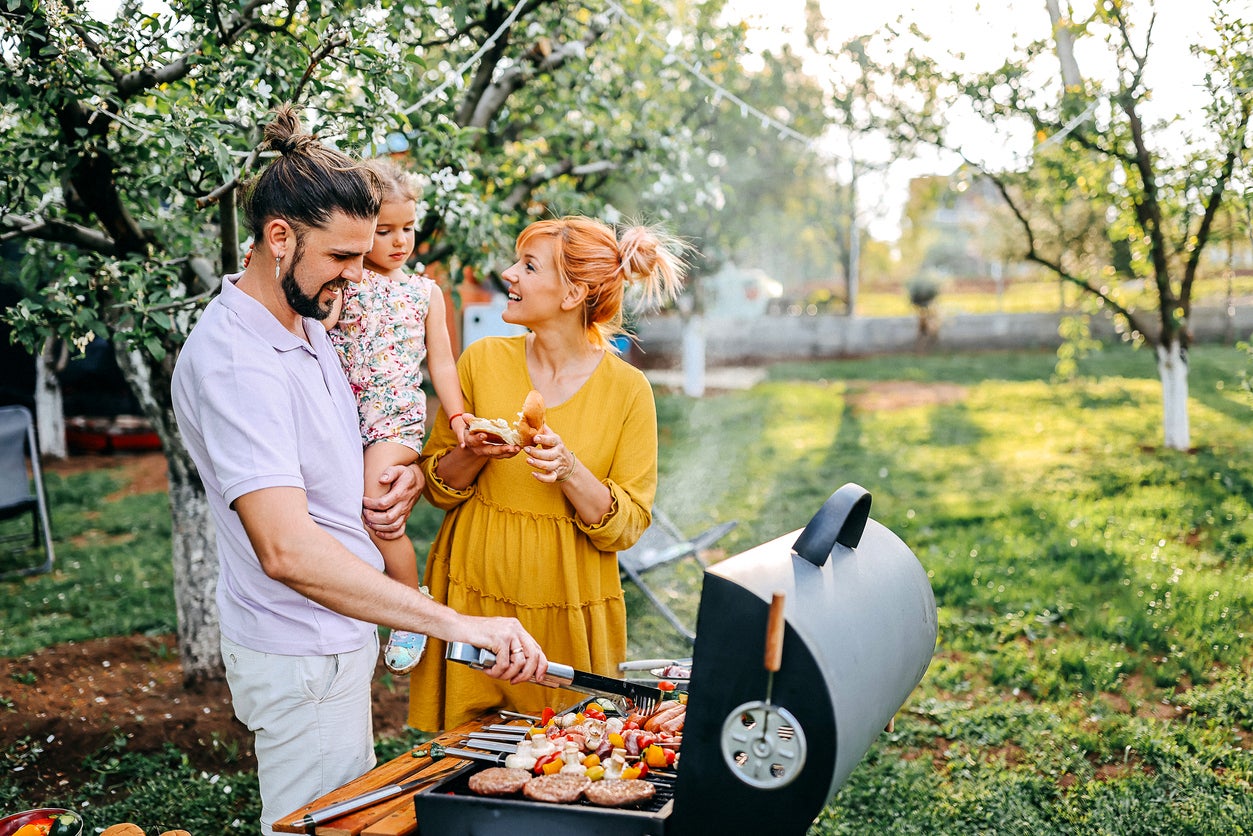 File photo: A family prepares are barbeque