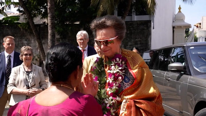 <p>Princess Anne dons flower garland and husband smashes coconut during Hindu Temple visit.</p>