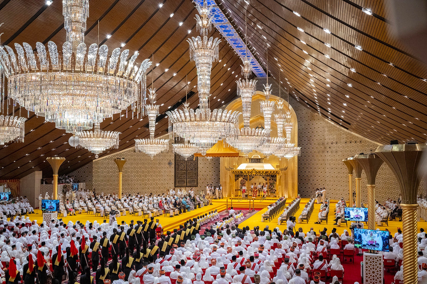 This picture taken by Brunei's Information Department on 10 January 2024 shows the royal powdering ceremony for Brunei's Prince Abdul Mateen's, center, at Istana Nurul Iman, ahead of his wedding with Anisha Rosnah, in Bandar Seri Begawan, Brunei