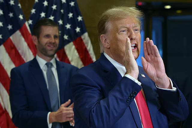 <p>Former U.S. President Donald Trump gestures to supporters as he speaks to the media at one of his properties, 40 Wall Street, following closing arguments at his civil fraud trial on 11 January 2024</p>