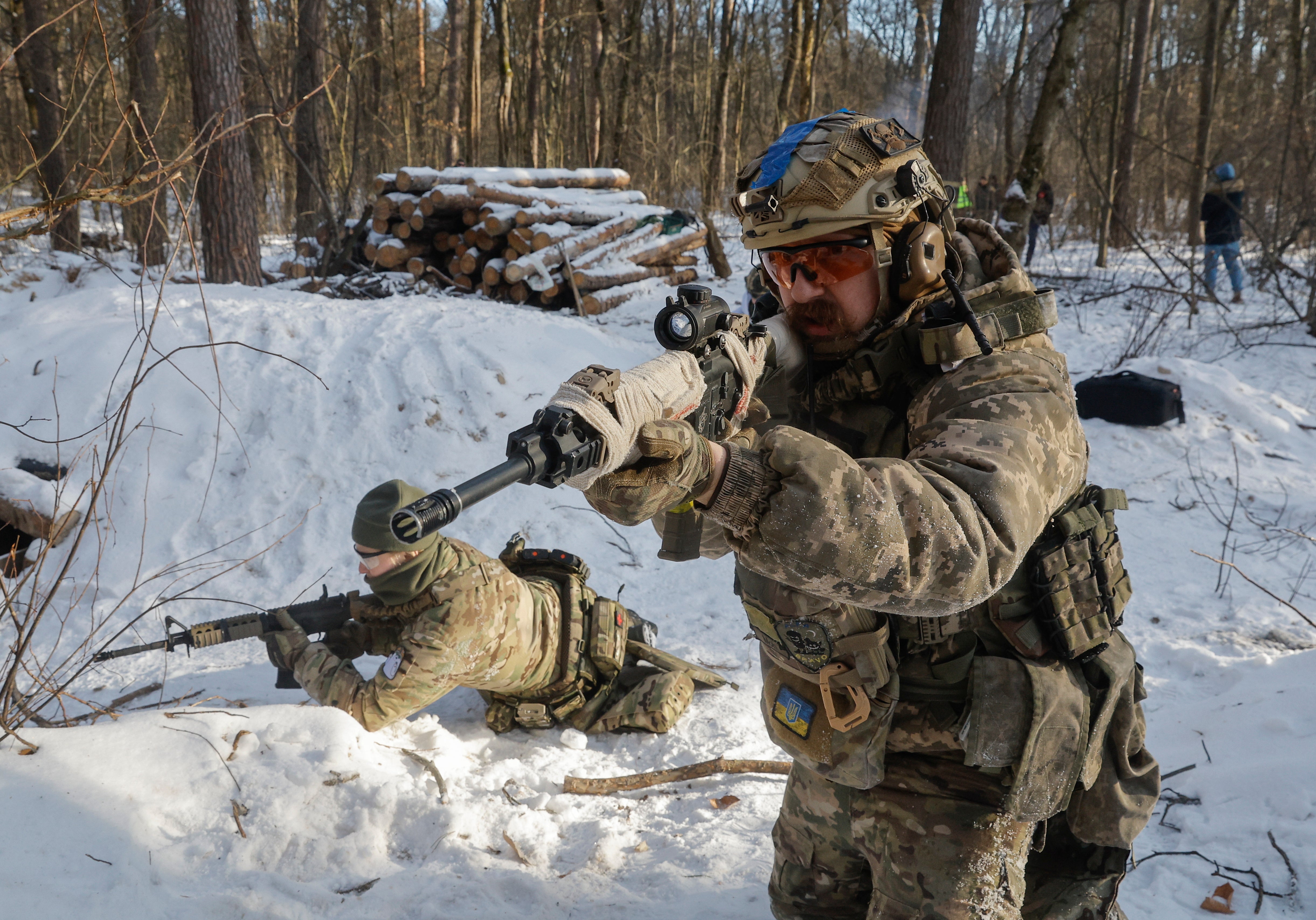 Ukrainian civilians attend their final military training after a five-day course near Kyiv, Ukraine, 12 January 2024