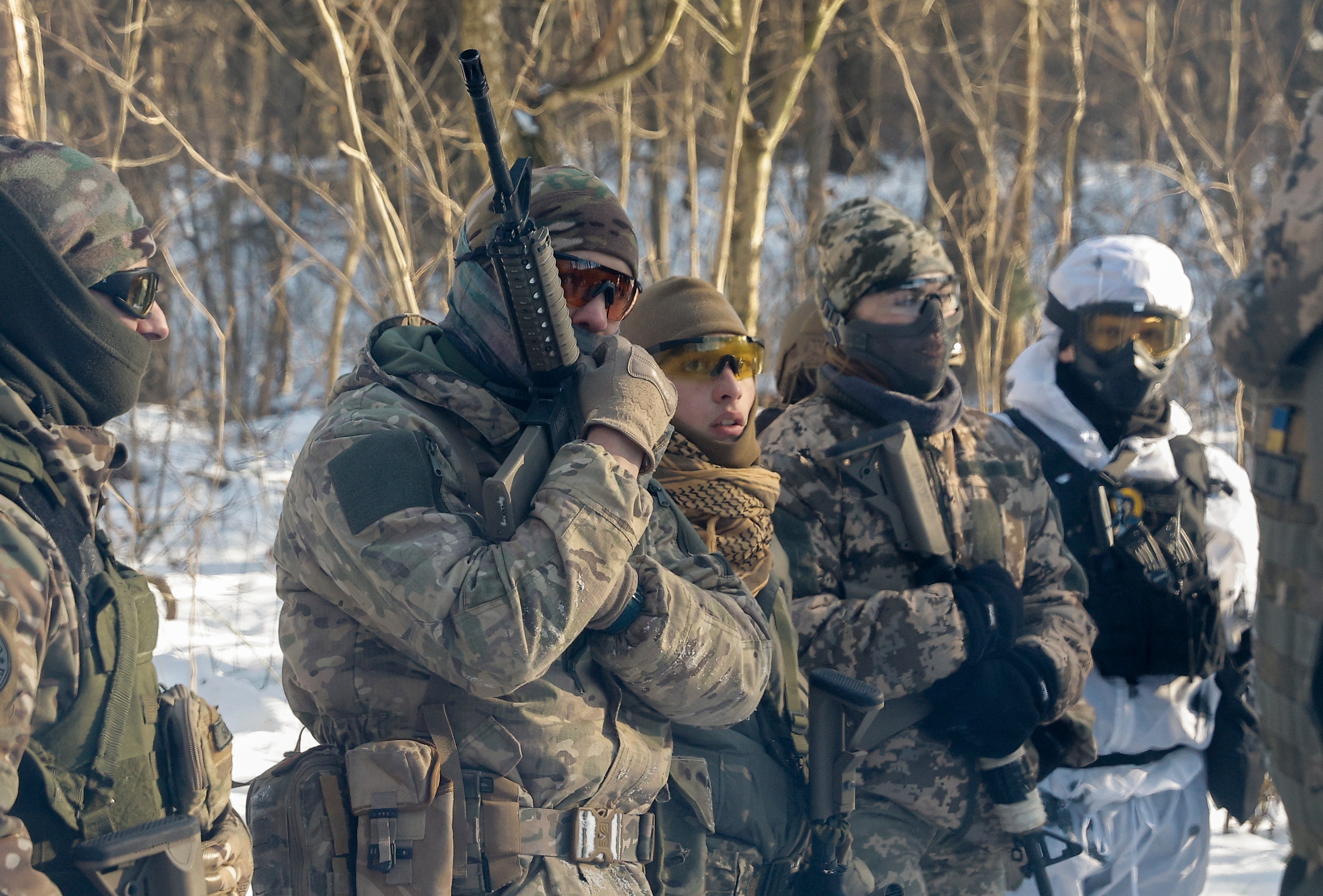 Ukrainian civilians attend their final military training after a five-day course near Kyiv, Ukraine, 12 January 2024