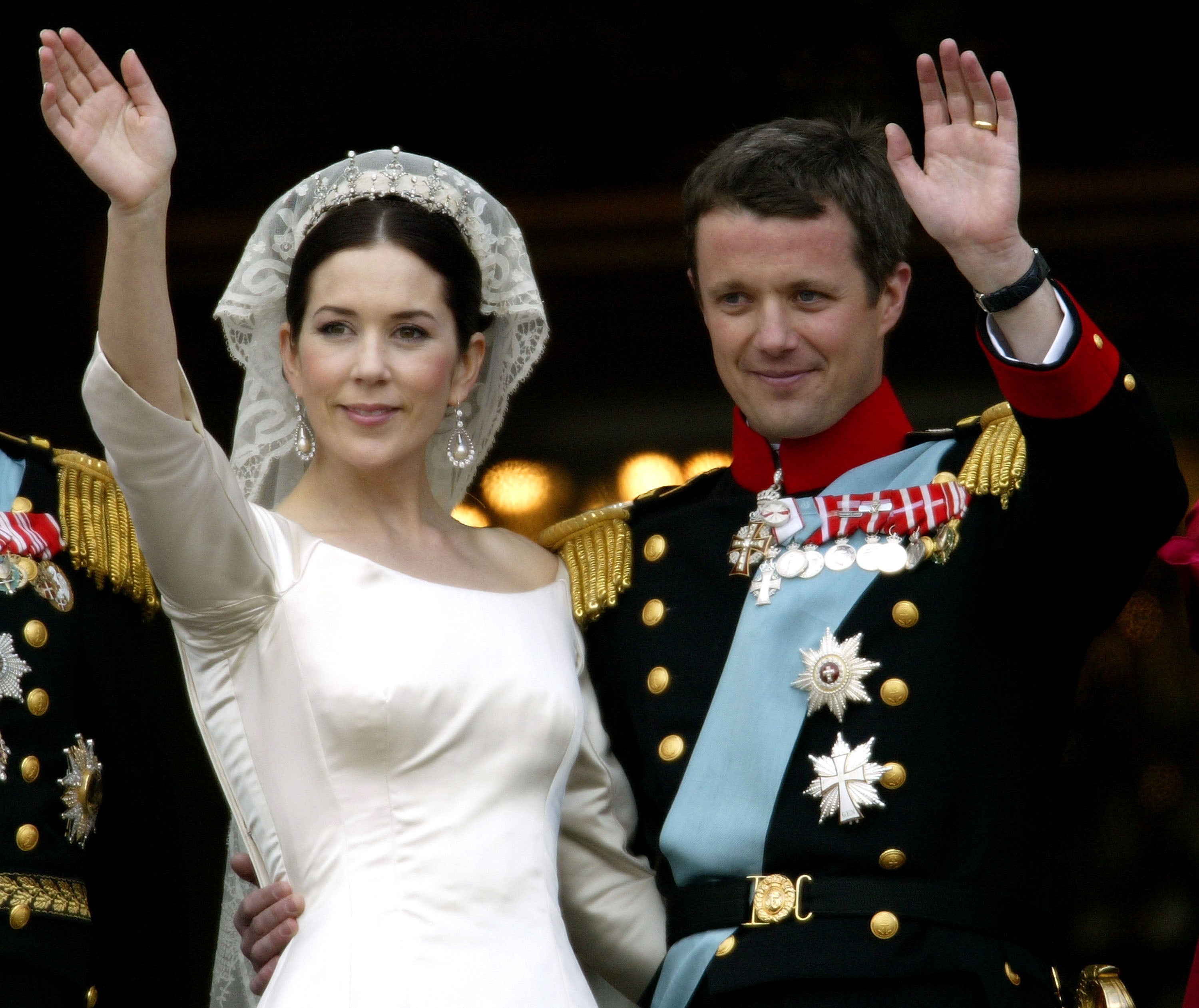Crown Princess Mary and Crown Prince Frederik of Denmark wave from the balcony of Christian VII’s Palace after their wedding on 14 May 2004 in Copenhagen, Denmark