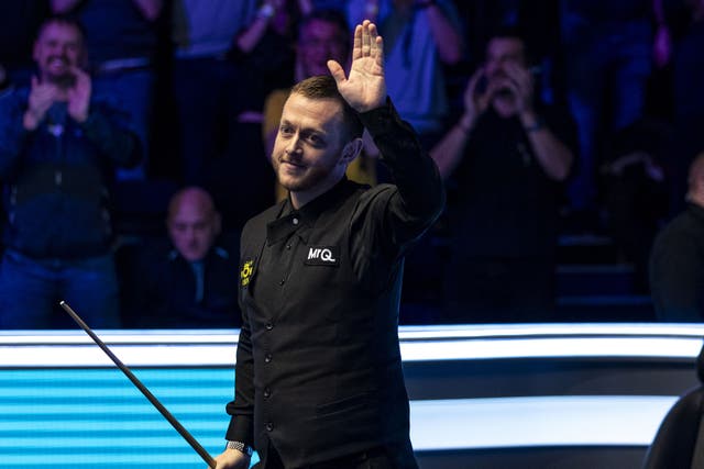 Mark Allen celebrates making a 147 in his quarter final match against Mark Selby (not in picture) during day six of the MrQ Masters at Alexandra Palace, London (Steven Paston/PA)