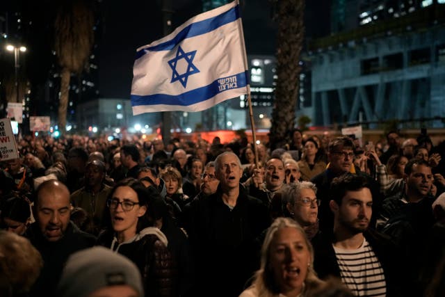 <p>People attend a demonstration in Tel Aviv on Saturday calling for the release of the hostages taken by Hamas militants </p>