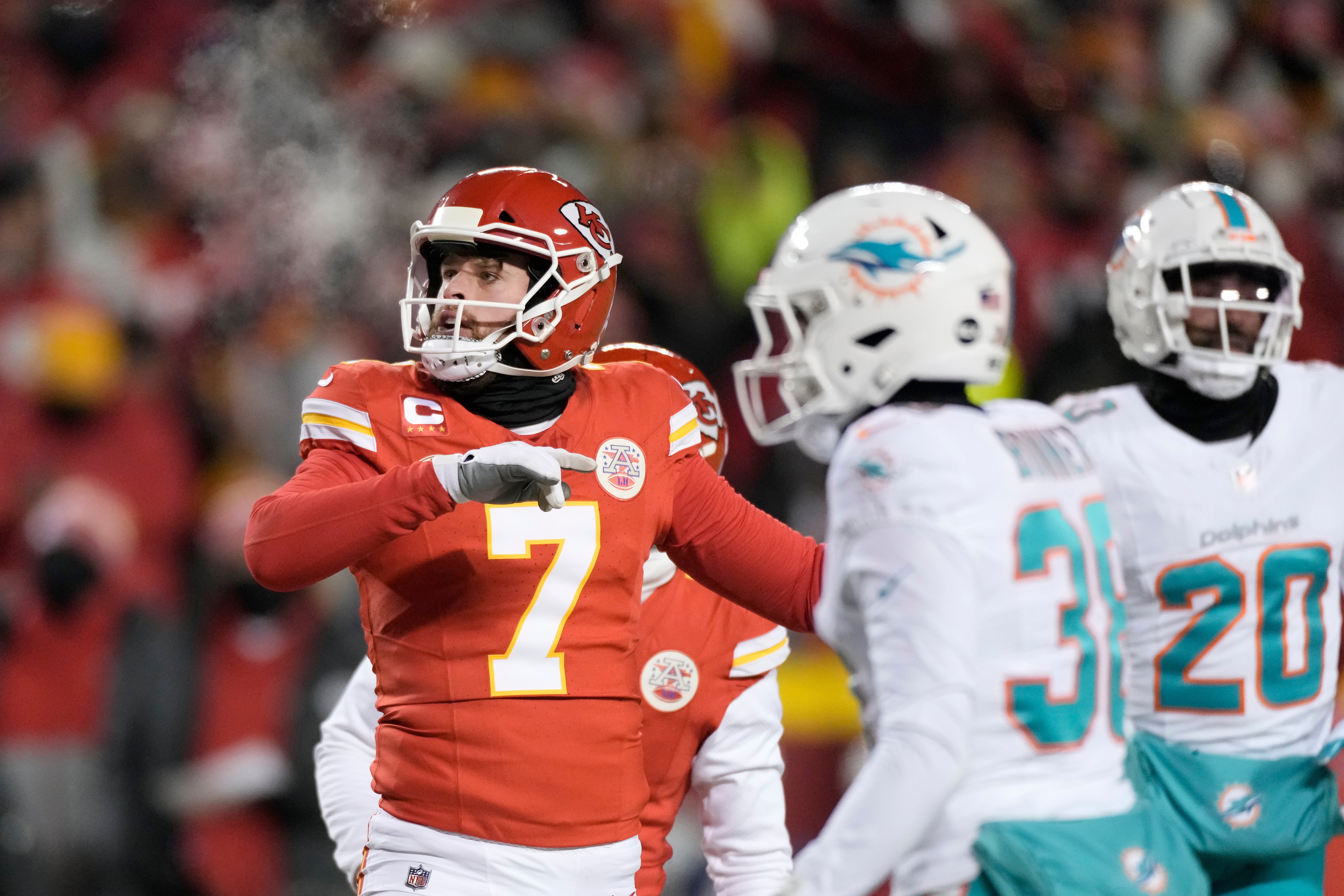 Kansas City Chiefs placekicker Harrison Butker watches his field goal during the first half of an NFL wild-card playoff game against the Miami Dolphins