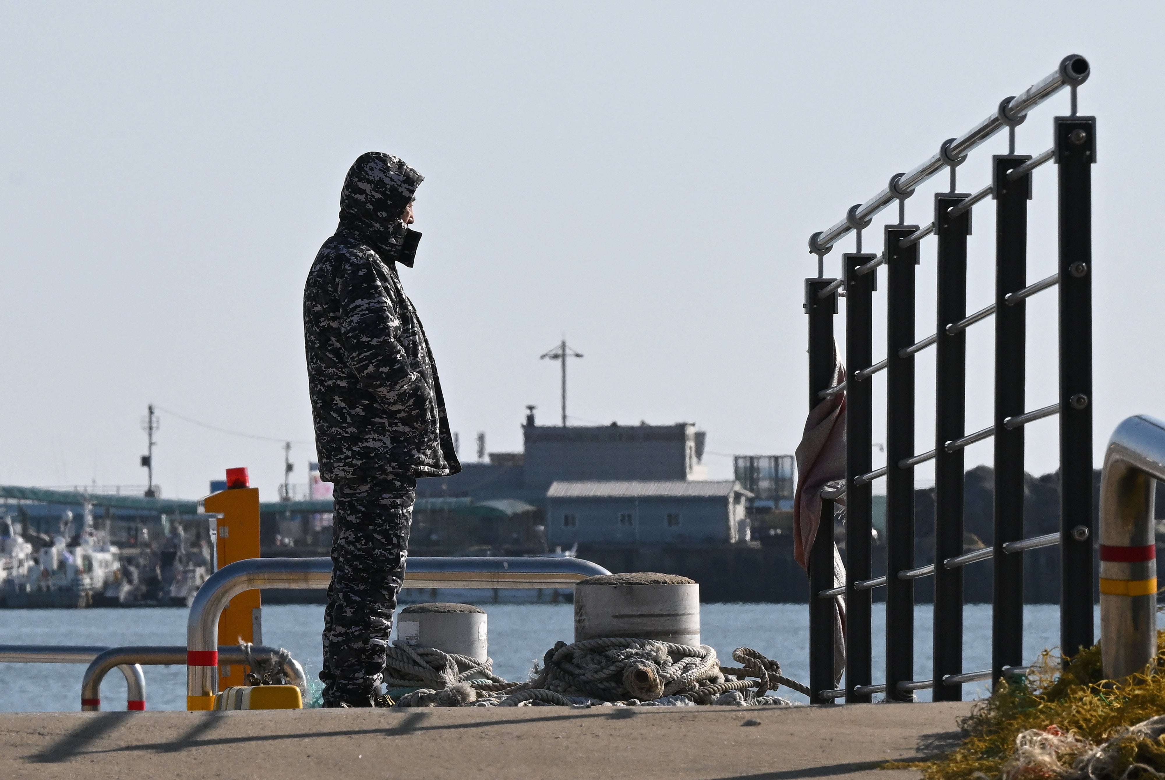 A man stands on a pier at Yeonpyeong island, near the ‘northern limit line’ sea boundary with North Korea, on 6 January 2024, a day after North Korea’s shelling