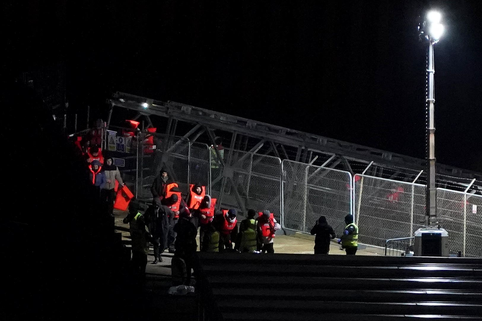 A group of people thought to be migrants are brought in to Dover, Kent, from a Border Force vessel following a small boat incident in the Channel (Gareth Fuller/PA)