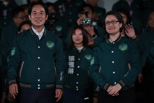 Taiwan’s President-elect Lai Ching-te (L) and his running mate Hsiao Bi-khim attend a rally outside the headquarters of the Democratic Progressive Party (DPP) in Taipei on 13 January 2024
