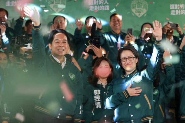 <p>Taiwan’s President-elect Lai Ching-te and his running mate Hsiao Bi-khim attend a rally outside the headquarters of the Democratic Progressive Party (DPP) in Taipei on 13 January</p>