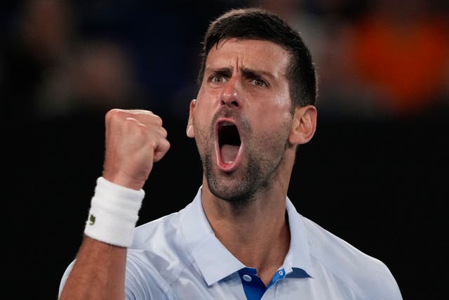 Novak Djokovic celebrates winning the third set against Dino Prizmic (Andy Wong/AP)