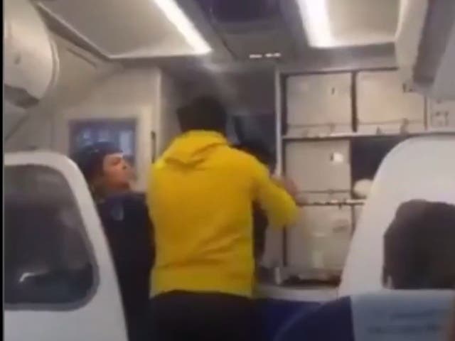 <p>Social media footage shows the passenger assaulting the pilot on an IndiGo Airlines flight from Delhi as he announced a 13-hour delay in departure </p>