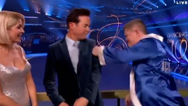 <p>Dancing on Ice’s Ricky Hatton sends presenter flying with joke punch on live TV.</p>