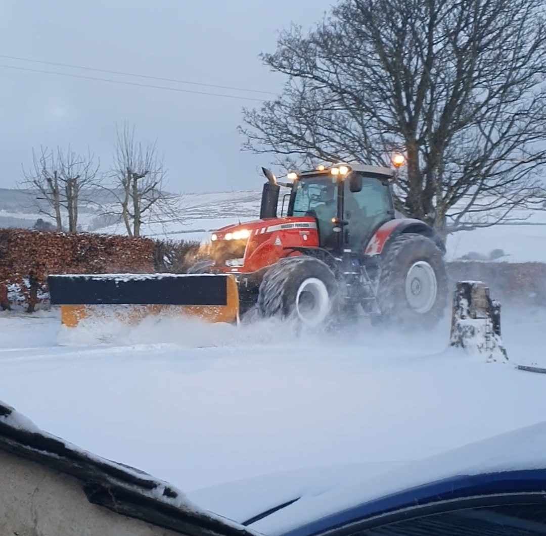 A snow plough battles to clear a road in Aberdeenshire
