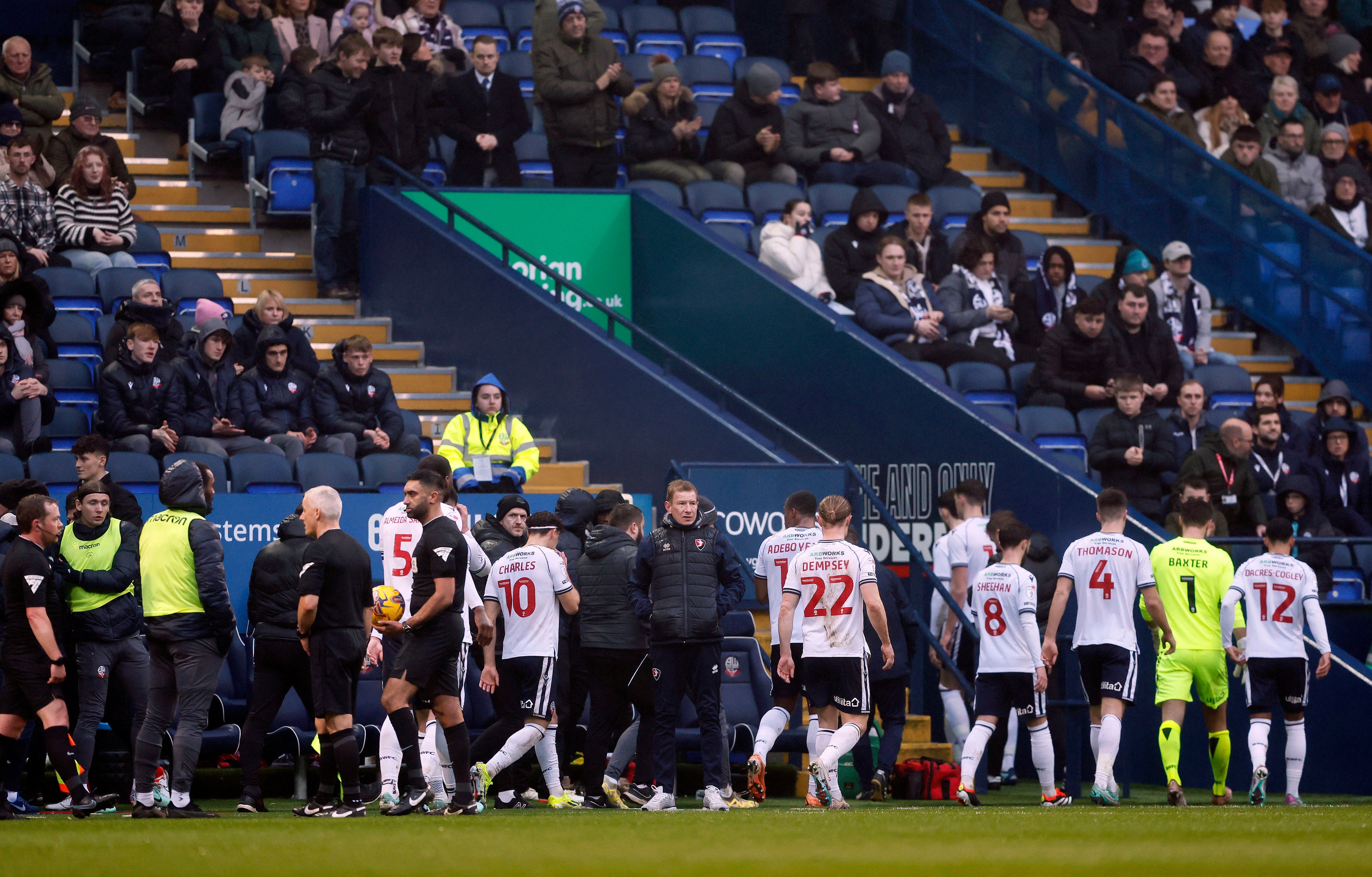 The game between Bolton and Cheltenham was called off after the supporter collapsed and needed medical help