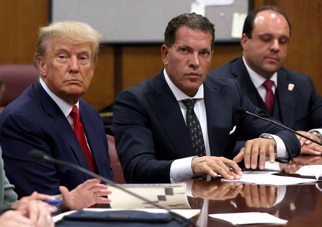 <p>Joe Tacopina, pictured above with Donald Trump, represented the former president in two major cases before he withdrew from his team on Monday</p>