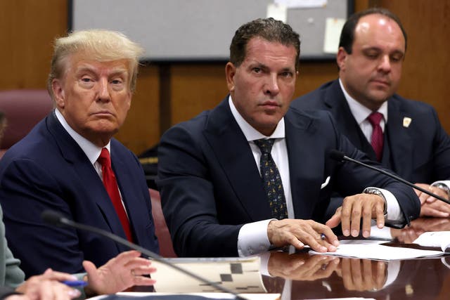 <p>Joe Tacopina, pictured above with Donald Trump, represented the former president in two major cases before he withdrew from his team on Monday</p>