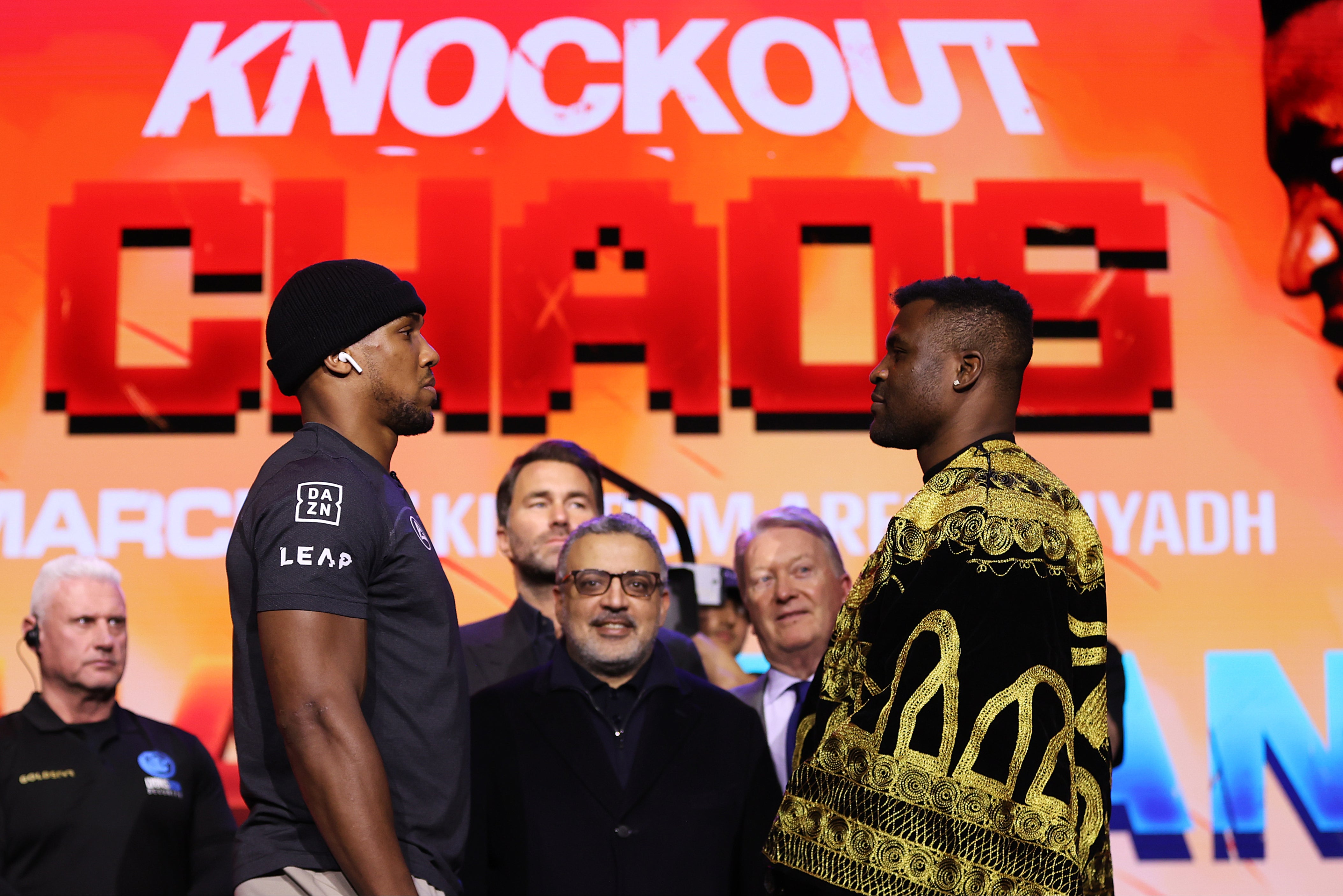 Anthony Joshua (centre left) faces off with Francis Ngannou