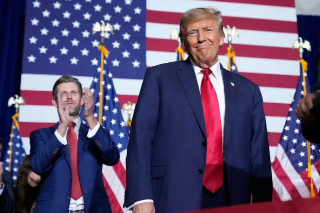 <p>Republican presidential candidate former President Donald Trump stands on stage as he speaks at a caucus night party in Des Moines, Iowa, Monday, Jan. 15, 2024</p>