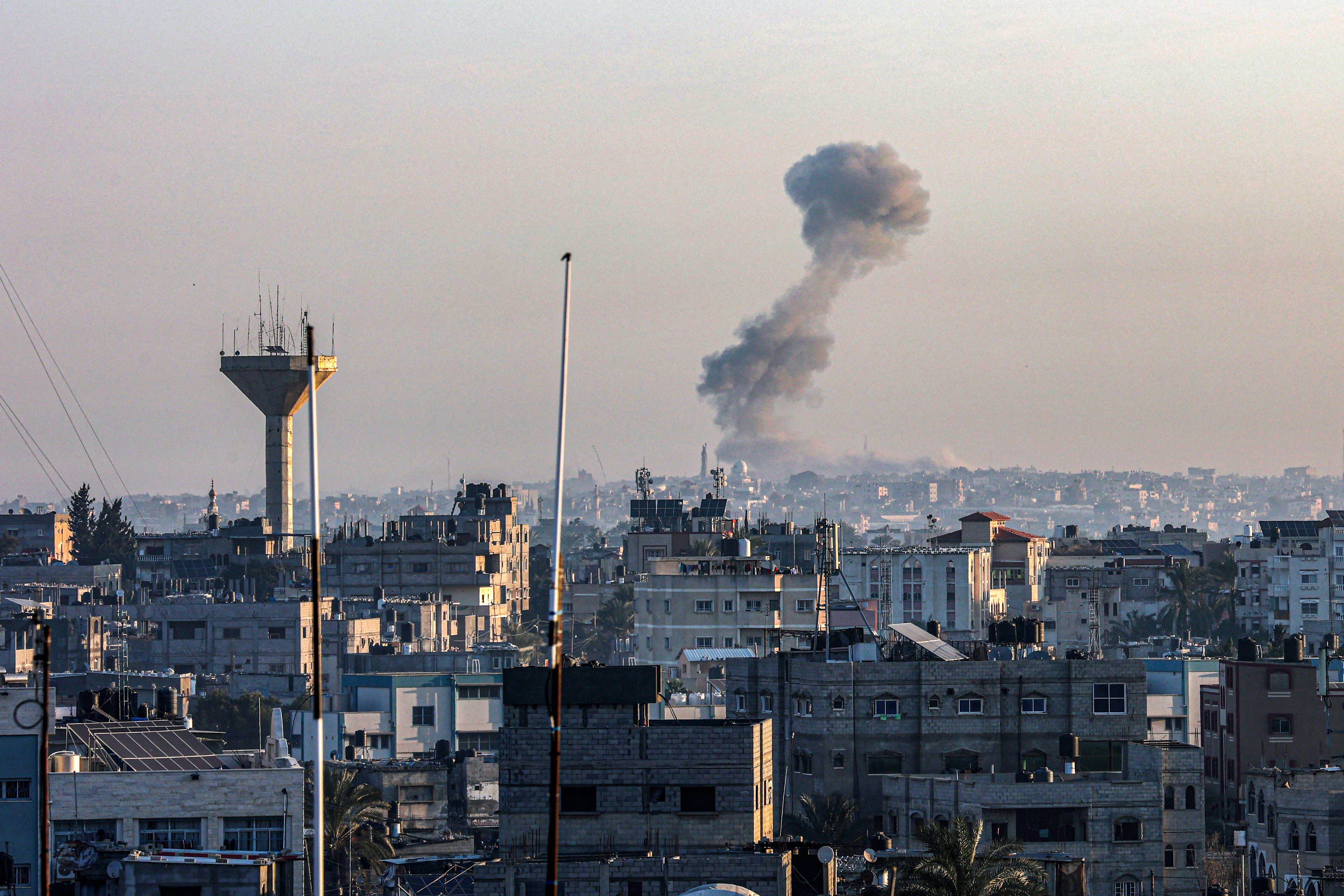 Smoke billowing over Khan Younis in the southern Gaza Strip as Israel carries out airstrikes