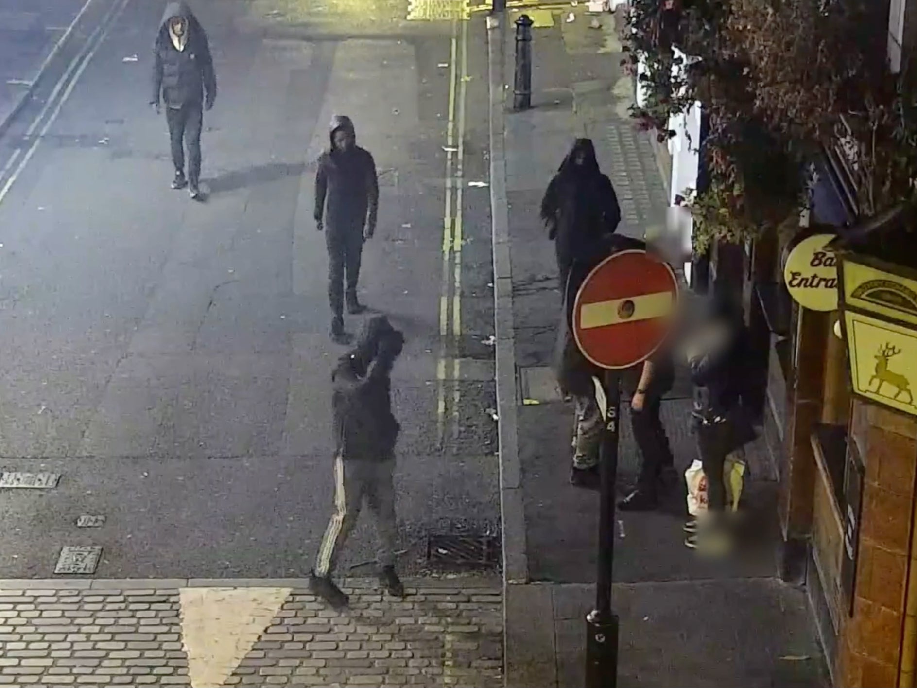 CCTV of an undercover officer wearing a luxury watch being followed by four thieves with their hoods up in London’s West End in October 2022.