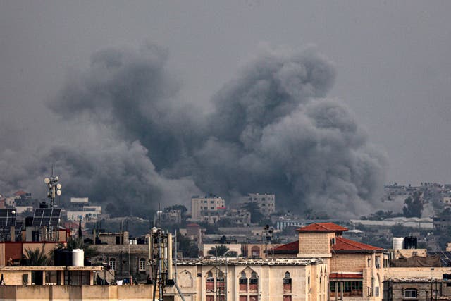 <p>Smoke billowing over the city of Khan Younis in the southern Gaza Strip </p>