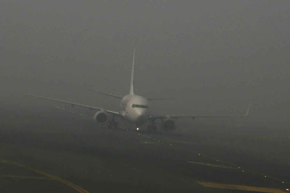 Passengers caught on planes for 12 hours pressured to eat meals on tarmac as fog causes journey chaos in India