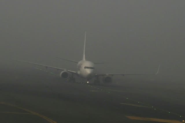 <p>An aircraft prepares to take off amid dense fog on a cold winter morning at Indira Gandhi International Airport in New Delhi</p>
