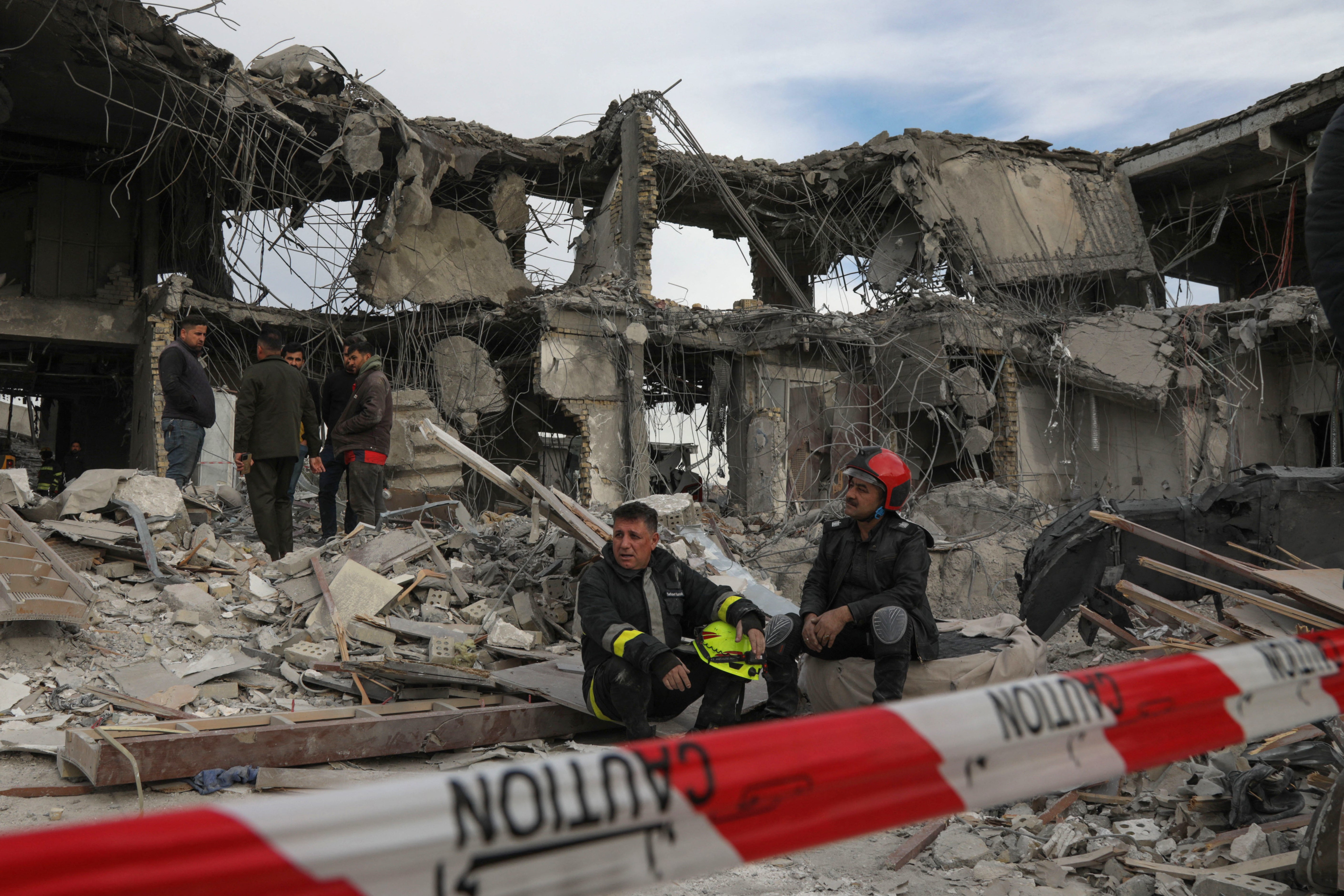 A civil defence team carries out search and rescue operations in a damaged building following a missile strike launched by the IRGC in the Kurdistan region of Iraq