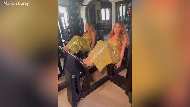 <p>Mariah Carey does gym workout wearing sequined gold gown and platform heels.</p>