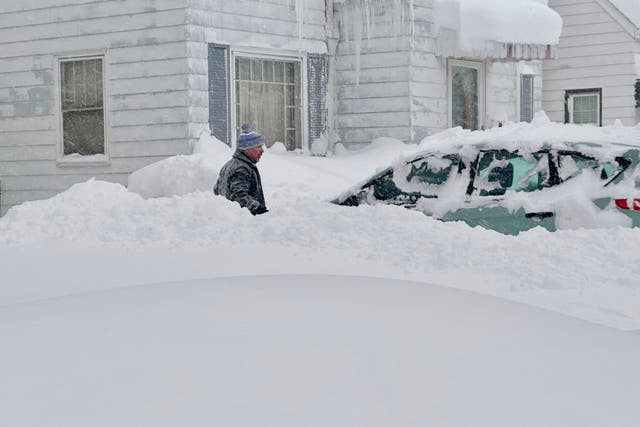 <p>Patrick Sahr is out just after sunrise shoveling snow from his car and driveway after at least 18 inches of new snow fell overnight - on top of the three feet that arrived over the weekend in Buffalo, N.Y., Wednesday, Jan. 17, 2024. </p>