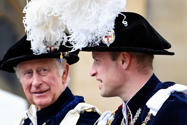 Charles with his son and heir William (Toby Melville/PA)