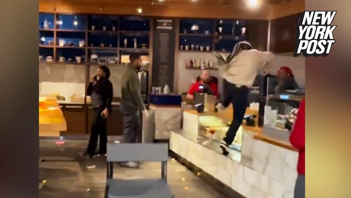 Airport restaurant employee leaps over counter and fights managers