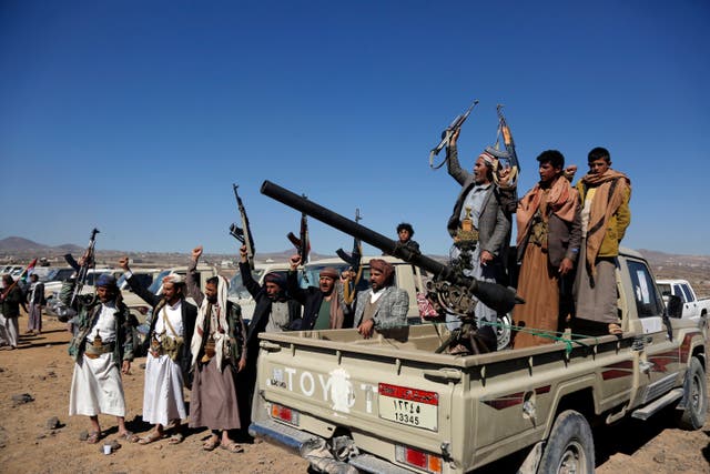 <p>Houthi fighters and tribesmen stage a rally against the US and the UK strikes on Houthi-run military sites near Sanaa, Yemen, in January </p>