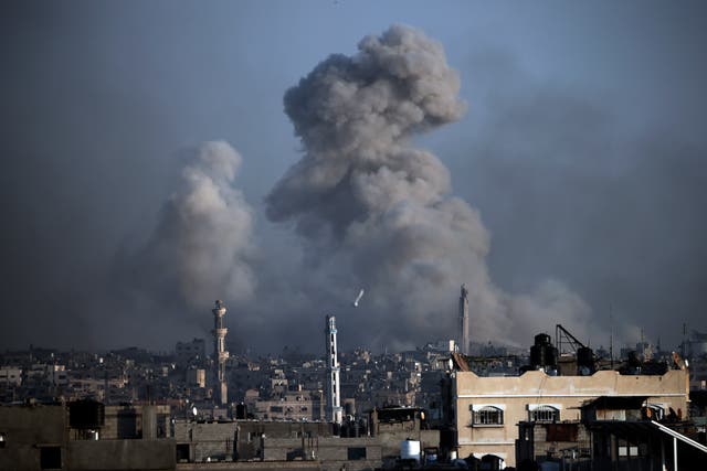 <p>Smoke rises following Israeli bombardments in Khan Younis</p>