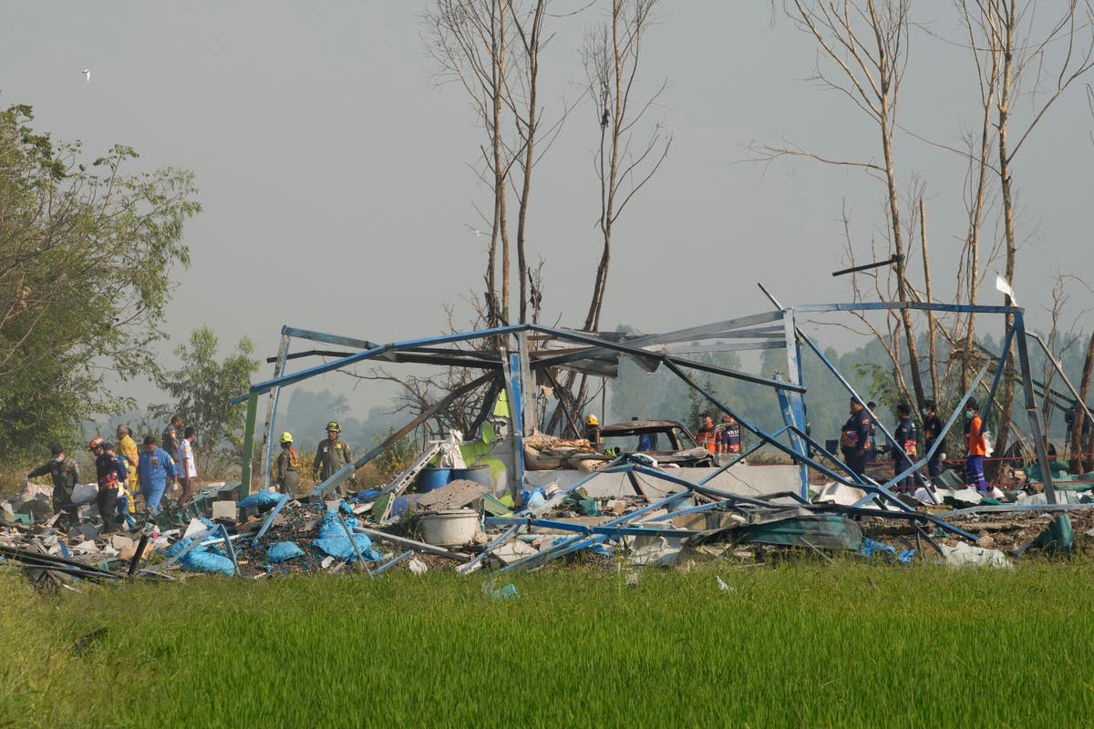 Remains of fireworks explosion victims taken to Thai temple where families give DNA to identify them