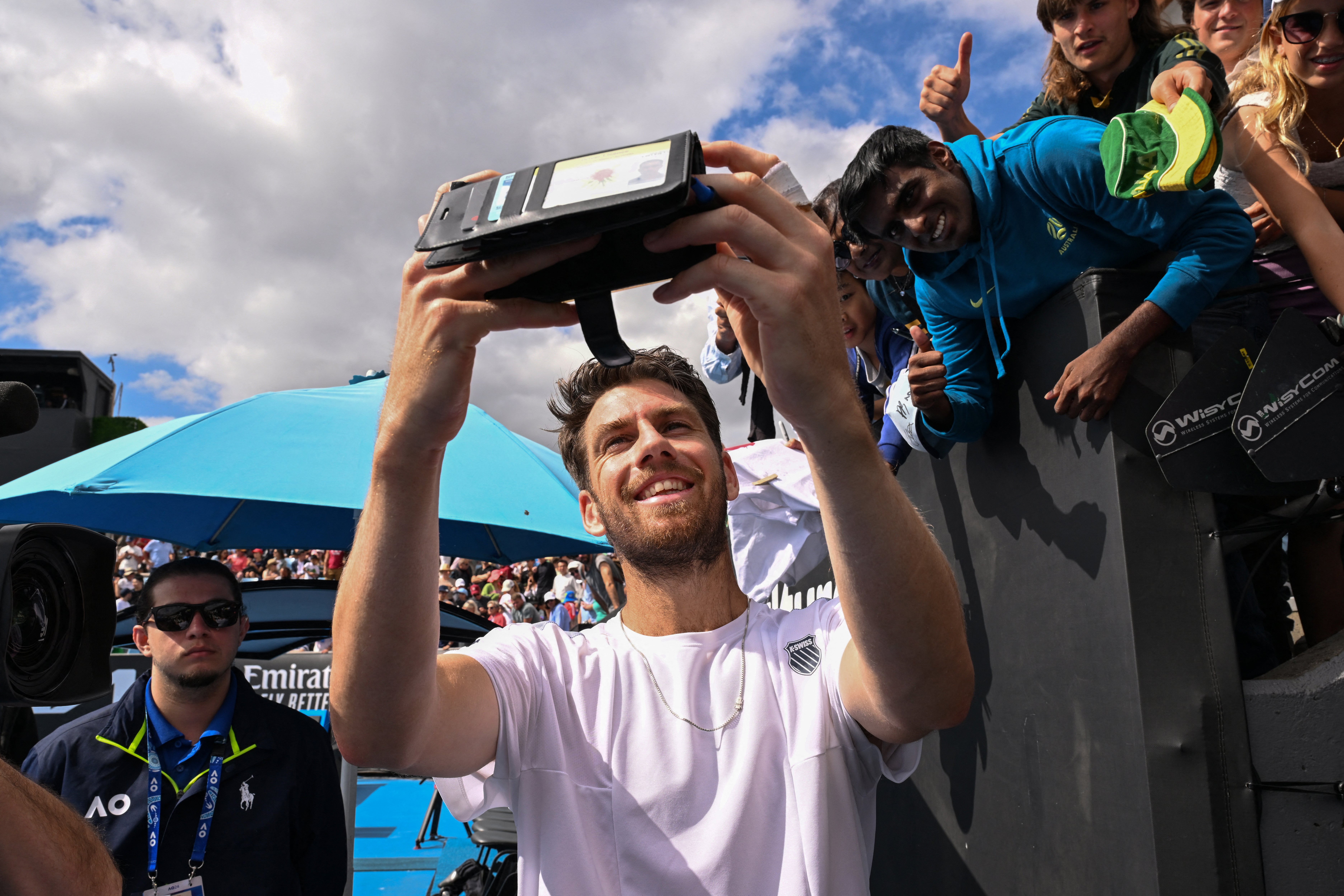 <p>Cameron Norrie poses for a selfie after beating Italy’s Giulio Zeppieri</p>
