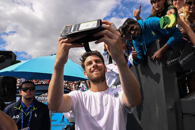 <p>Cameron Norrie poses for a selfie after beating Italy’s Giulio Zeppieri</p>
