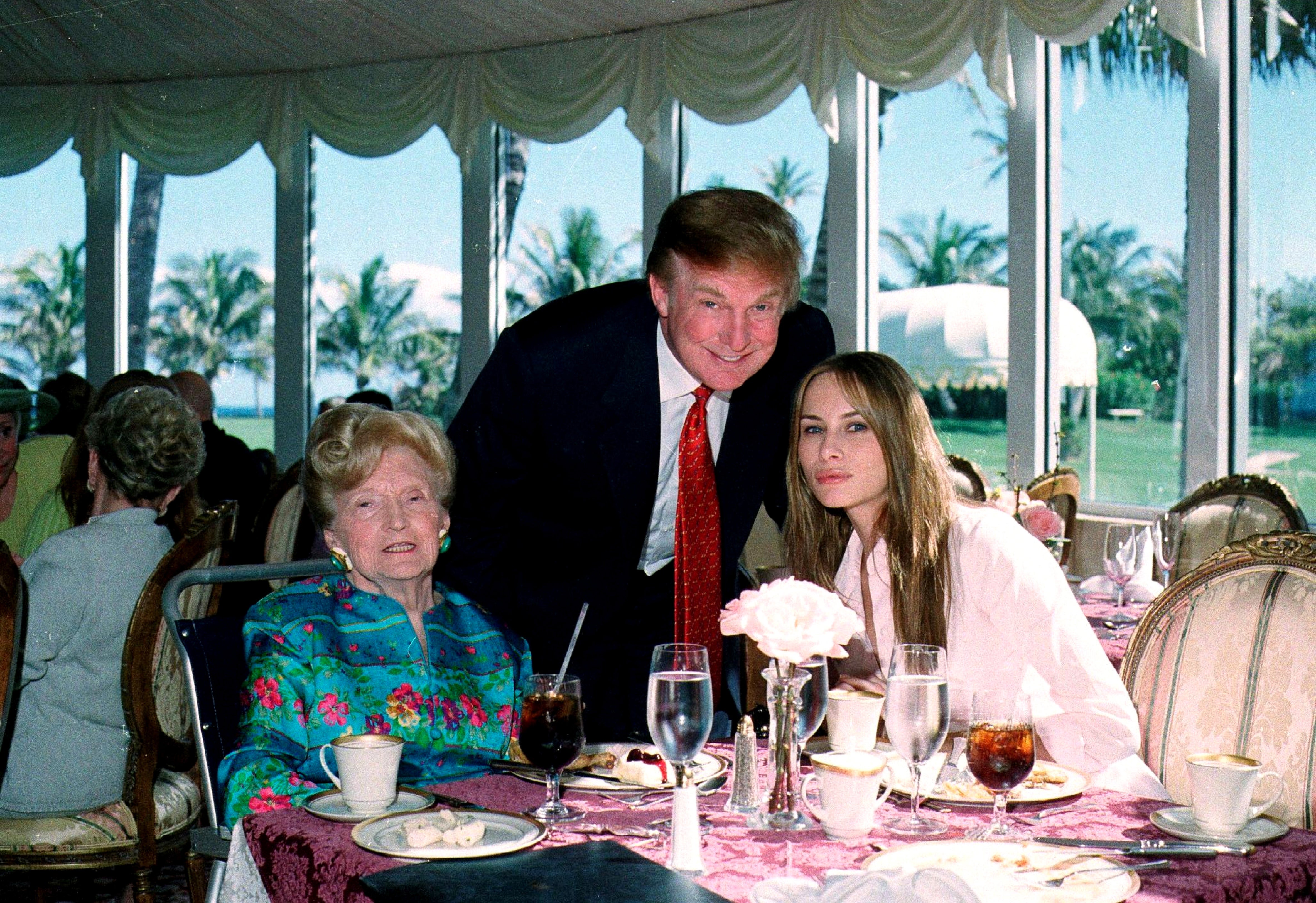 From left, American socialite Mary Trump, her son, Donald, and his girlfriend (and future wife), former model Melania Knauss, pictured at Mar-a-Lago in 2000