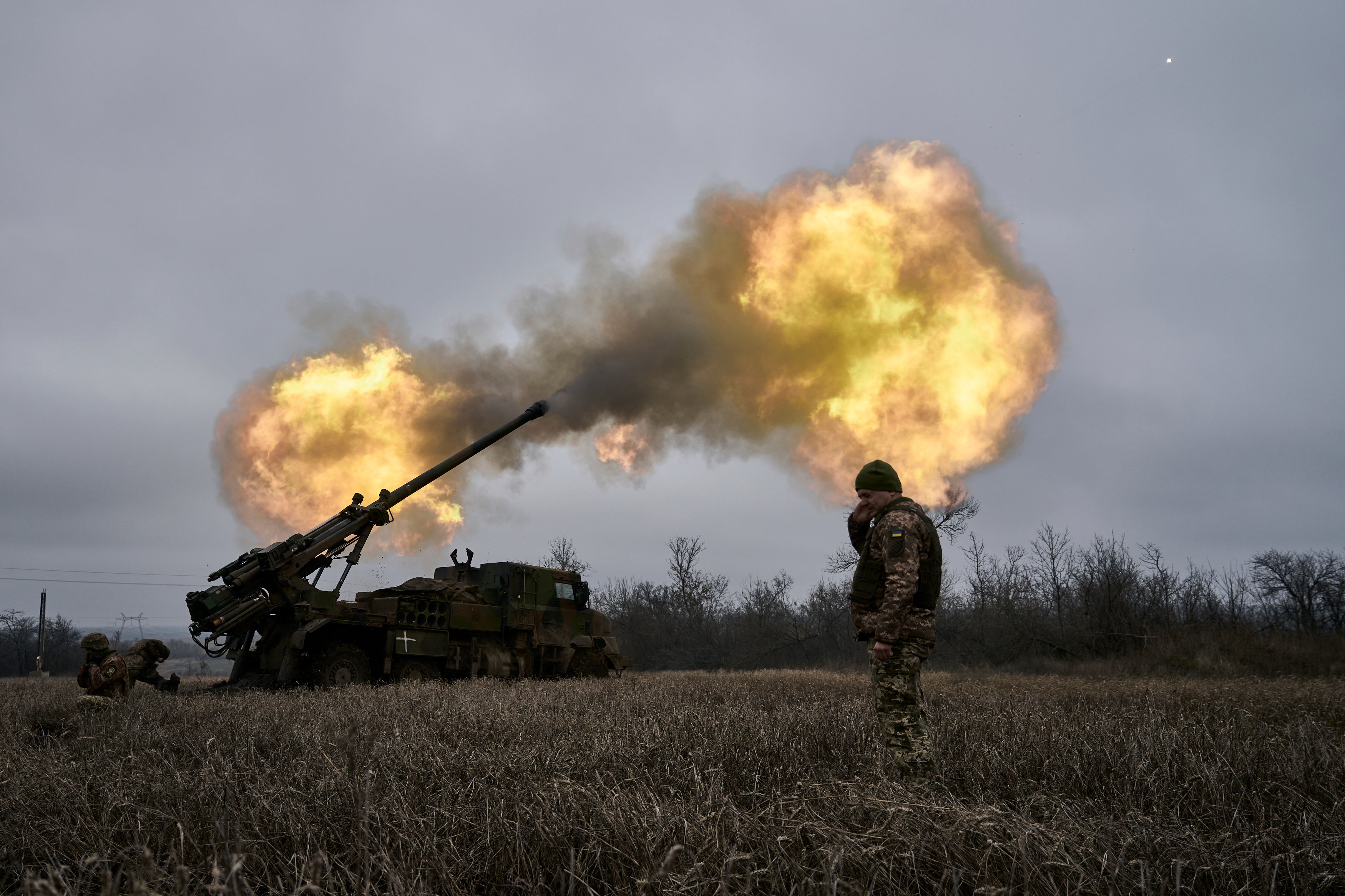 Ukrainian soldiers fire a French-made CAESAR self-propelled howitzer towards Russian positions near Avdiivka