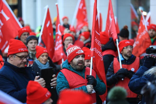Members of Nipsa on the picket line outside the Northern Ireland Office at Erskine House, Belfast (Liam McBurney/PA)