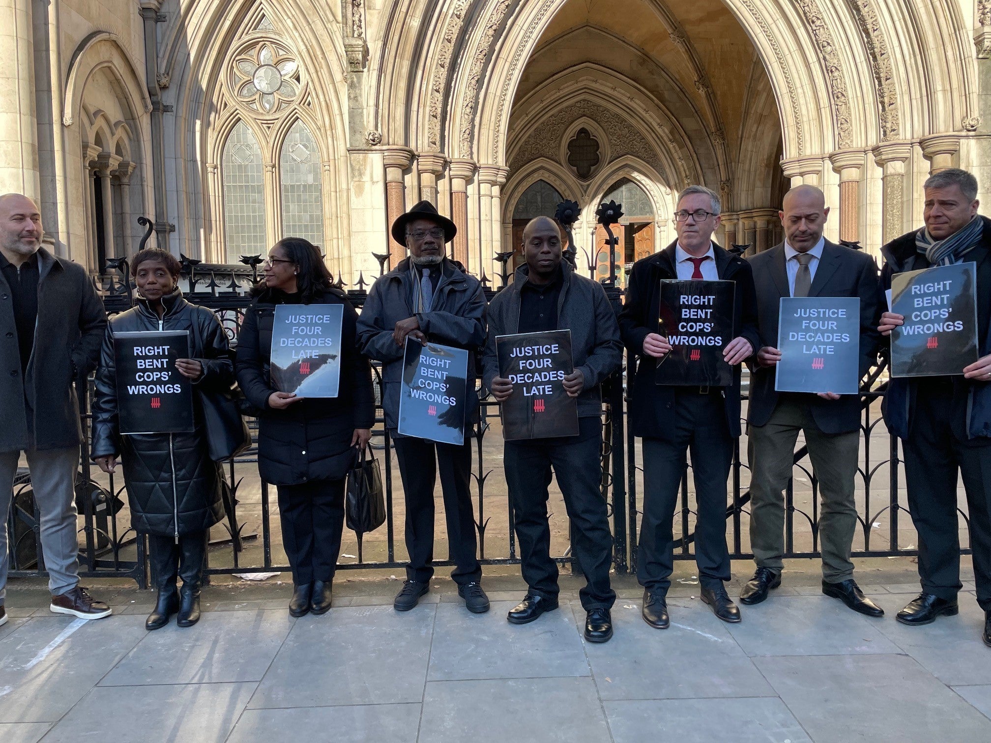 Supporters and family members of Basil Peterkin and Saliah Mehmet outside the Royal Court of Justice in London