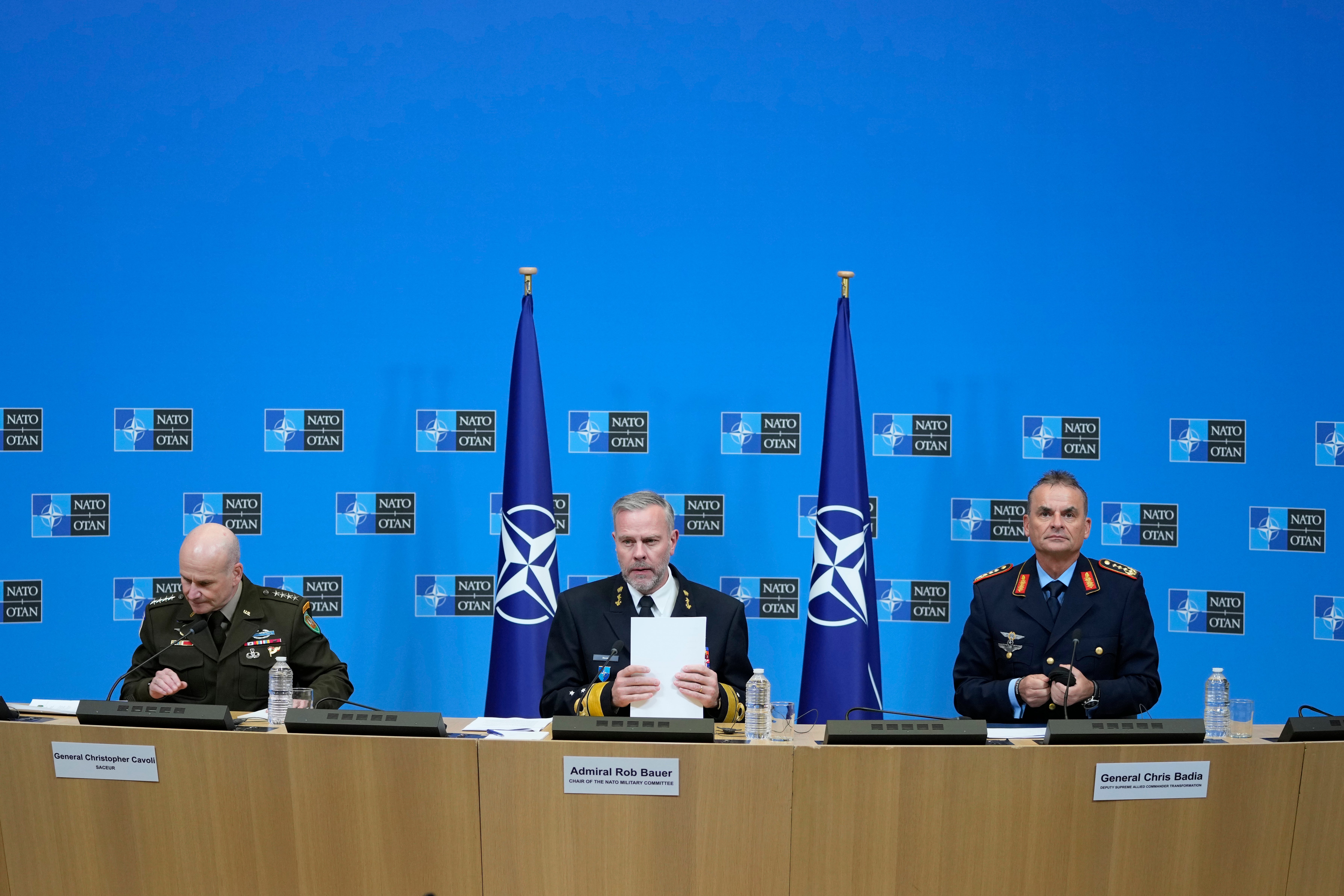 Admiral Rob Bauer (centre), General Christopher Cavoli (left) and General Chris Badia prepare to address a conference at Nato HQ in Brussels