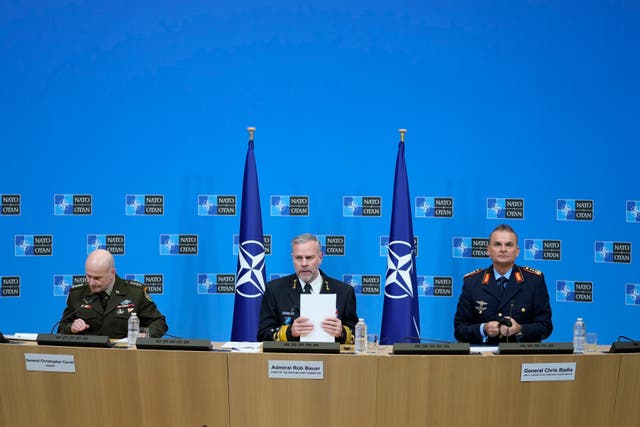 <p>Admiral Rob Bauer (centre), General Christopher Cavoli (left) and General Chris Badia prepare to address a conference at Nato HQ in Brussels</p>