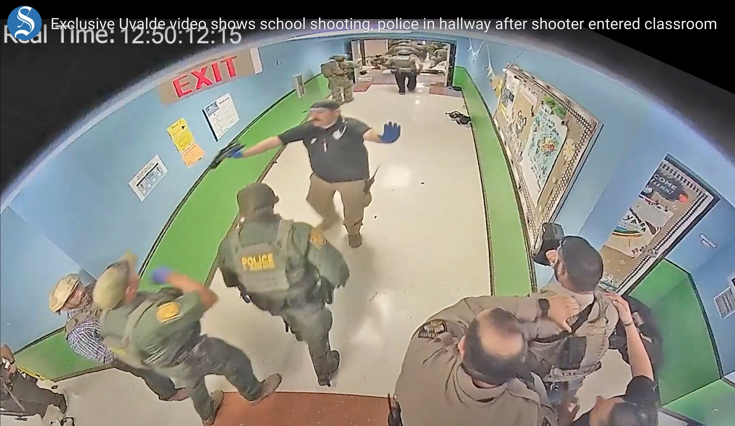 In this photo from surveillance video provided by the Uvalde Consolidated Independent School District via the Austin American-Statesman, authorities respond to the shooting at Robb Elementary School in Uvalde, Texas, on 24 May 2022